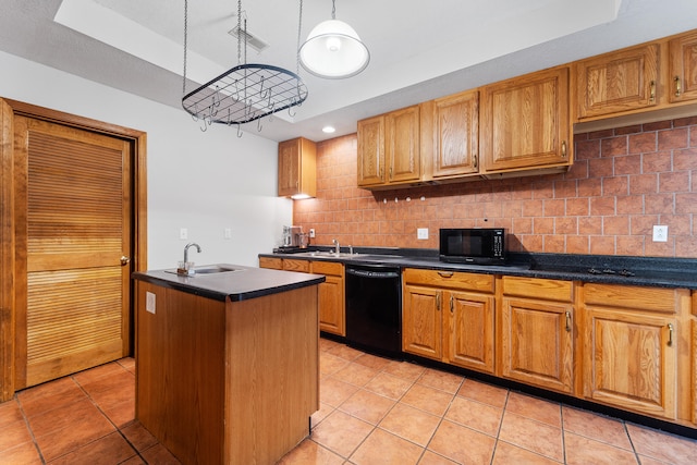 kitchen featuring pendant lighting, light tile patterned flooring, tasteful backsplash, sink, and black appliances