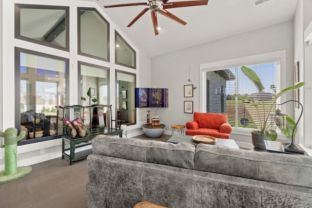 living room with ceiling fan and high vaulted ceiling