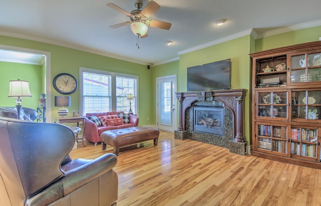4200 S Rangeline Rd, Columbia, MO 65201 - living area with a high end fireplace, wood finished floors, ceiling fan, ornamental molding, and baseboards