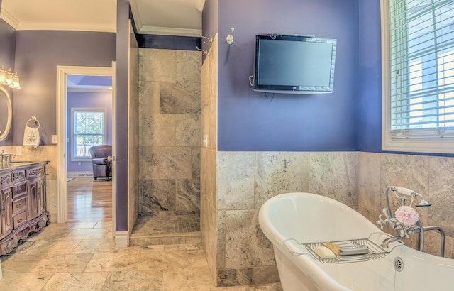 4200 S Rangeline Rd, Columbia, MO 65201 - full bath with crown molding, a freestanding bath, a tile shower, vanity, and tile walls