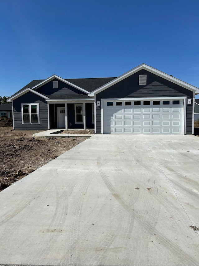 ranch-style house featuring a garage