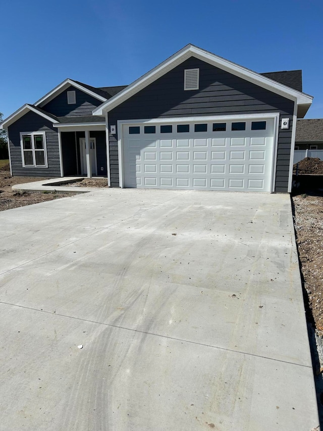 single story home with a garage