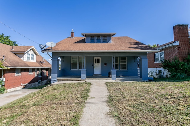 bungalow-style house featuring a front yard and a porch