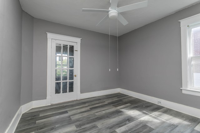 unfurnished room with ceiling fan and dark hardwood / wood-style floors