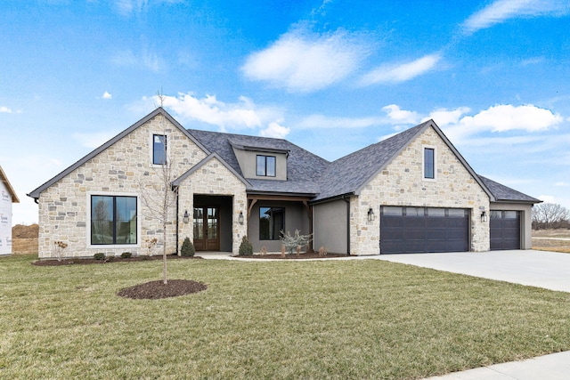 view of front facade featuring a garage and a front lawn