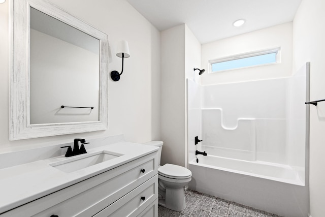 full bathroom with washtub / shower combination, vanity, and toilet