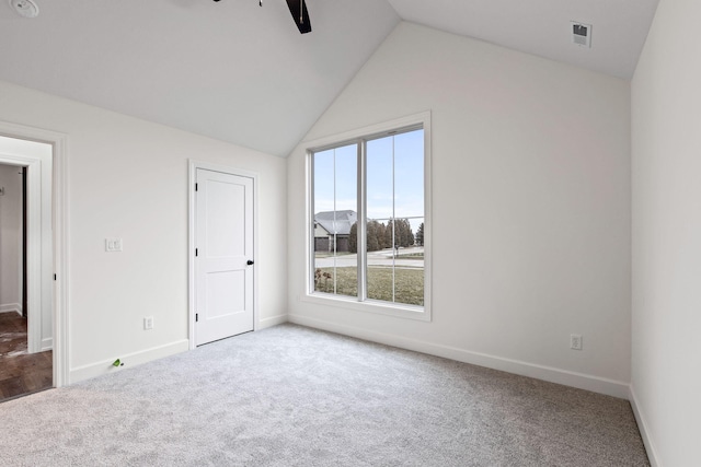 interior space with carpet floors, vaulted ceiling, and ceiling fan