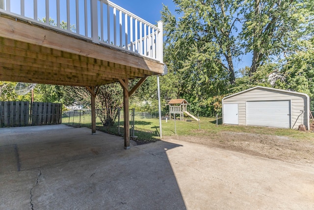 exterior space with an outdoor structure, a garage, and a deck