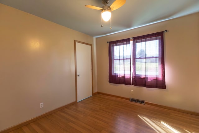 unfurnished room with ceiling fan and light hardwood / wood-style flooring