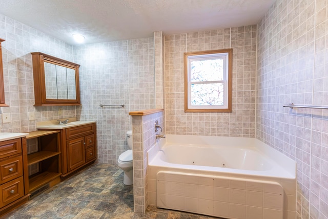 bathroom featuring tile walls, a bathtub, vanity, and toilet