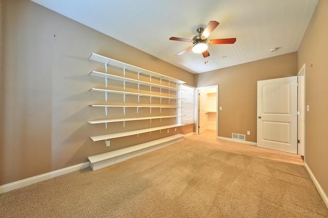 unfurnished bedroom with ceiling fan and carpet flooring