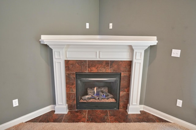 room details featuring a tiled fireplace