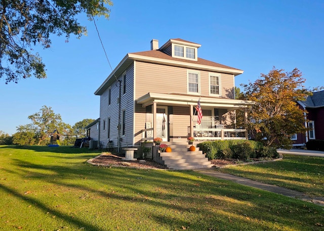 view of front facade with a porch and a front yard