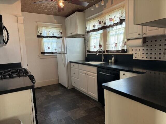 kitchen with ceiling fan, sink, white appliances, tasteful backsplash, and white cabinetry