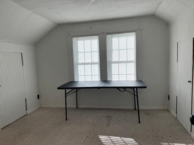 bonus room featuring light carpet and lofted ceiling