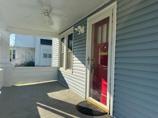 exterior space with covered porch and ceiling fan