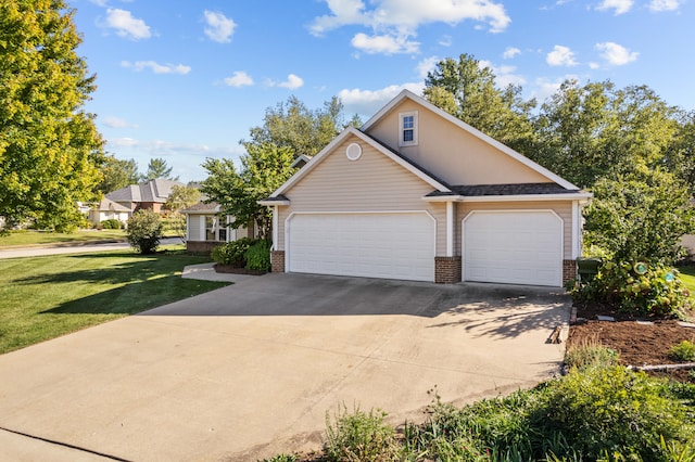 view of front property with a front yard and a garage