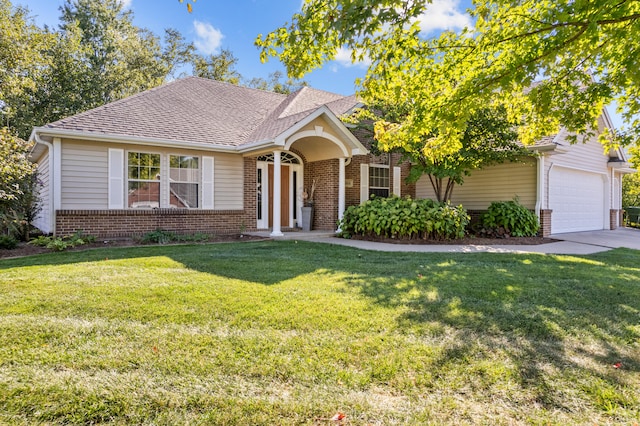 view of front of house featuring a front yard and a garage