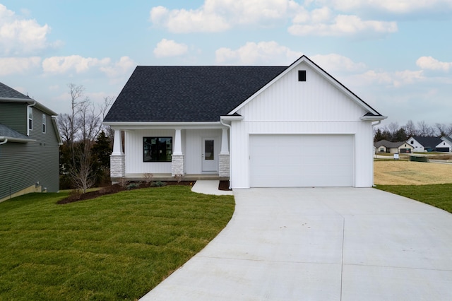 modern farmhouse with a garage, a front lawn, and covered porch