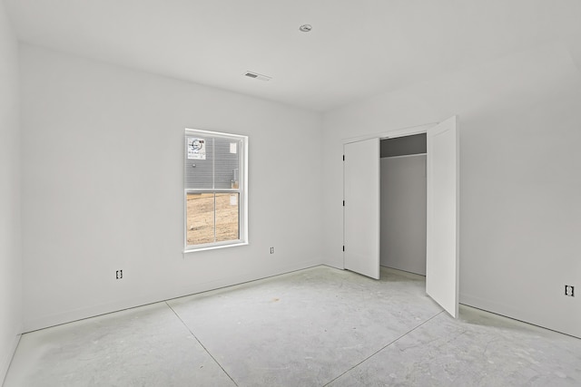 unfurnished bedroom with a closet