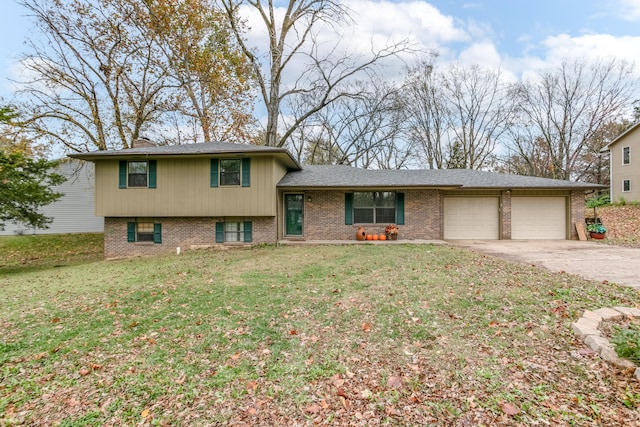 split level home with a garage and a front yard