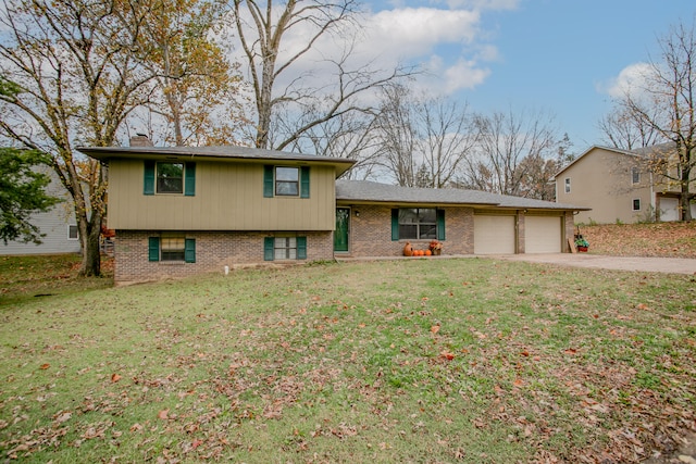 split level home with a front lawn and a garage