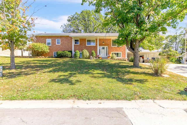 raised ranch featuring a front lawn