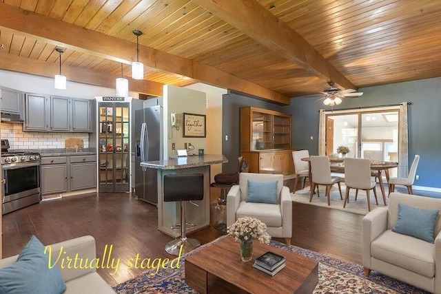 living room with wooden ceiling, dark hardwood / wood-style floors, beamed ceiling, and ceiling fan