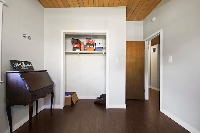 misc room featuring dark wood-type flooring and wooden ceiling