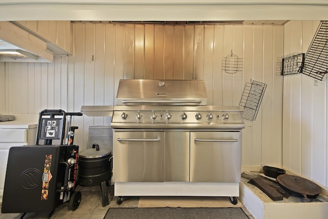 kitchen featuring wooden walls