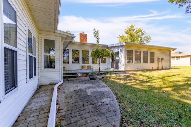 exterior space with a yard and a patio area