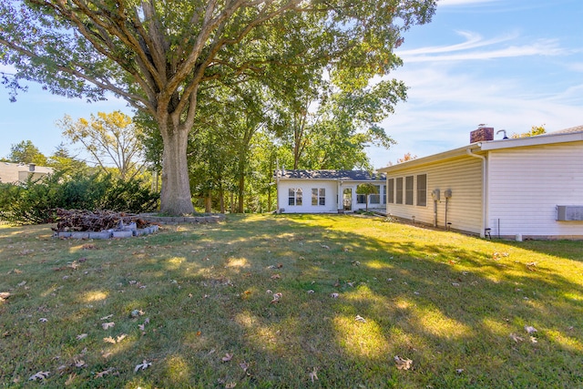 view of yard with central AC