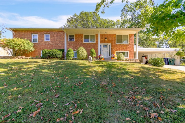 raised ranch with a front lawn and a carport