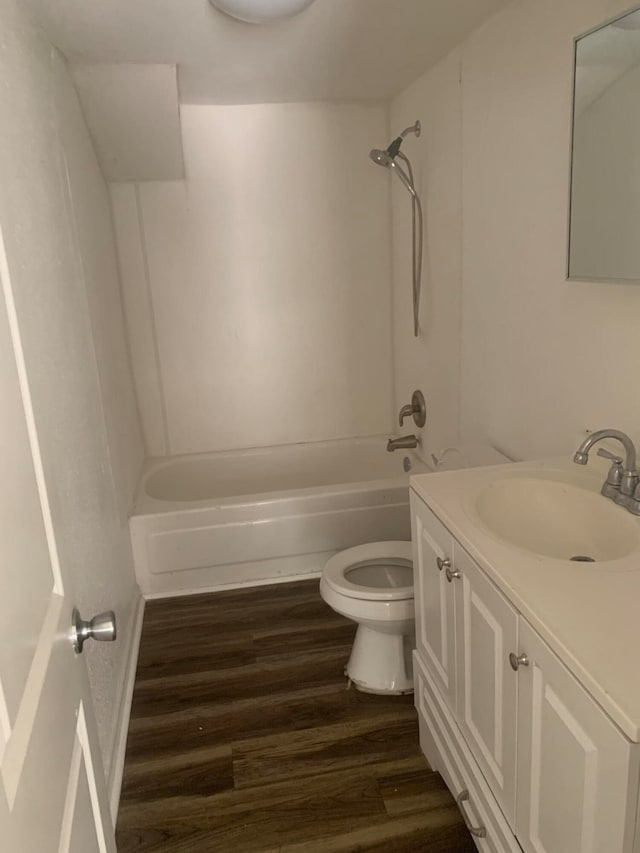 full bathroom featuring vanity, wood-type flooring, shower / bathtub combination, and toilet