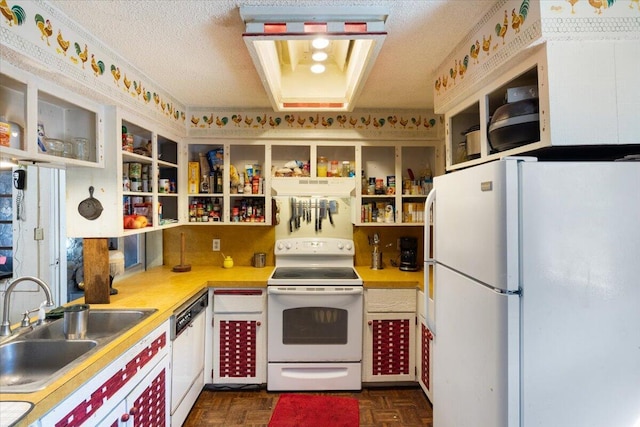 kitchen featuring a textured ceiling, dark parquet flooring, sink, and white appliances