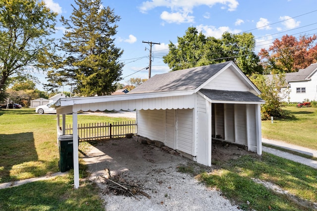 garage featuring a lawn