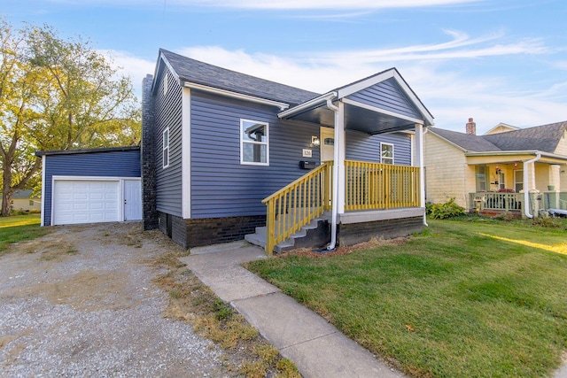 view of front facade featuring a front yard, a garage, and covered porch