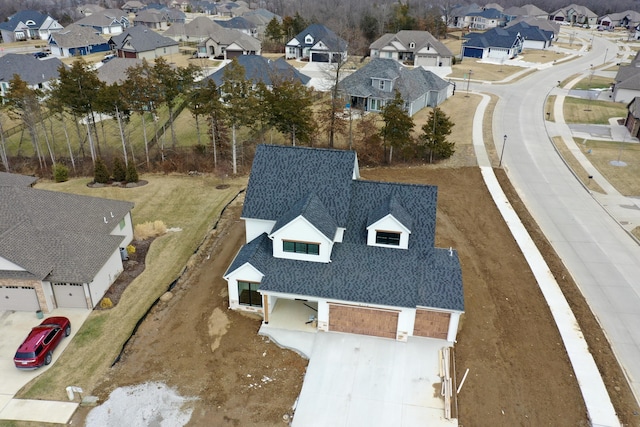 birds eye view of property with a residential view