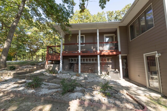 rear view of house with central air condition unit