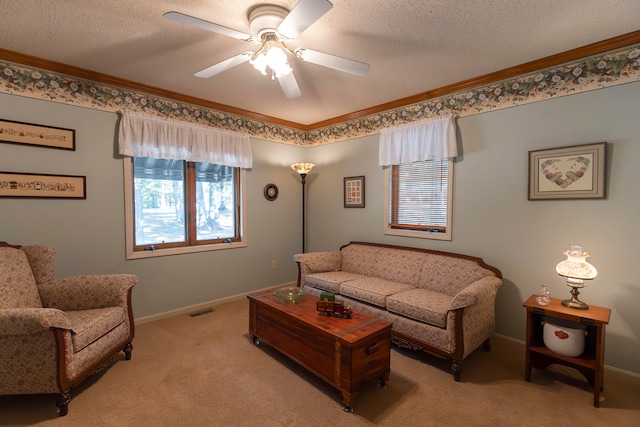 carpeted living room featuring ornamental molding, ceiling fan, and a textured ceiling