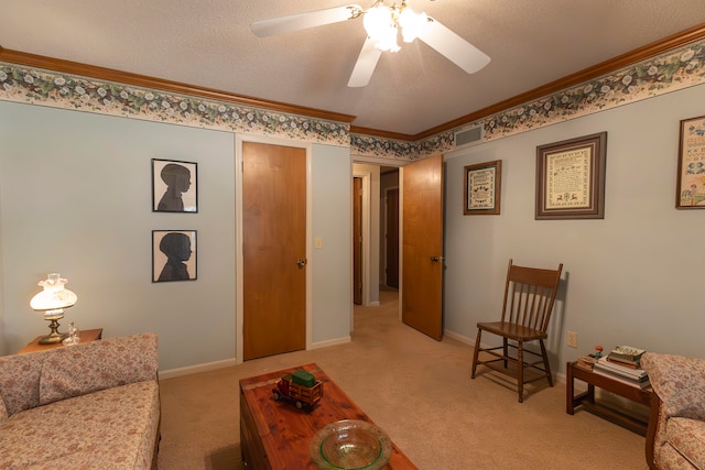 carpeted living room with ceiling fan, a textured ceiling, and ornamental molding