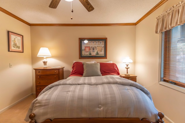 carpeted bedroom featuring ceiling fan, a textured ceiling, and crown molding