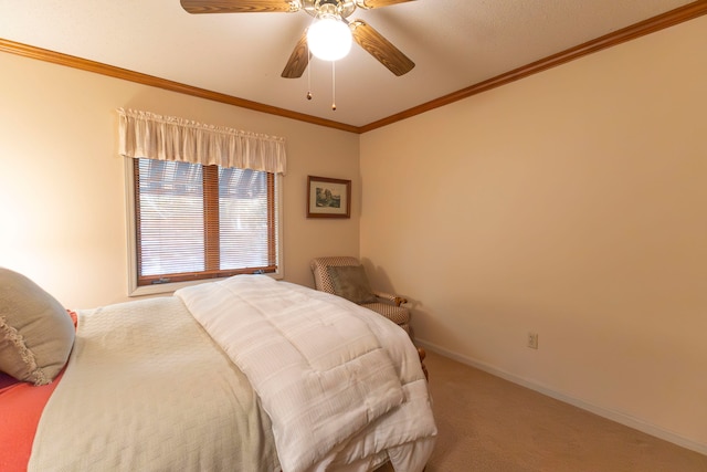 bedroom featuring ceiling fan, ornamental molding, and carpet