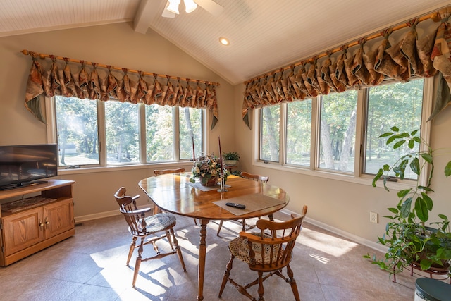 dining area with lofted ceiling with beams, light tile patterned floors, and ceiling fan