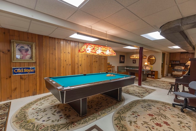 playroom with a drop ceiling, wood walls, and billiards