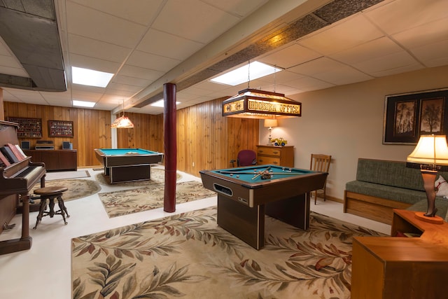 game room featuring billiards, light colored carpet, wooden walls, and a paneled ceiling