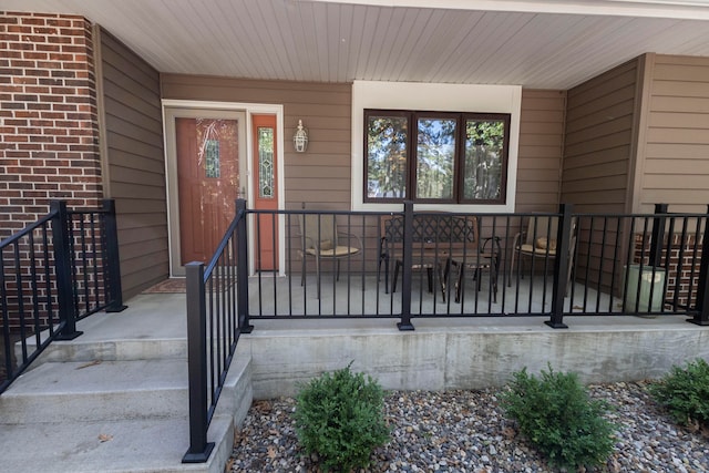 property entrance featuring covered porch