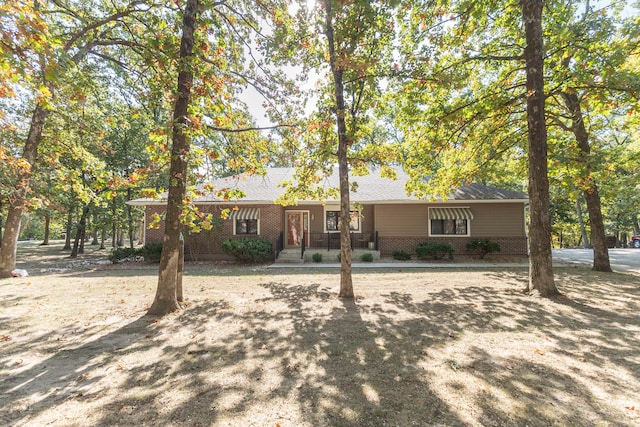 ranch-style house with covered porch