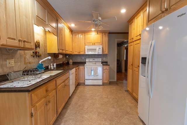 kitchen featuring ceiling fan, tasteful backsplash, white appliances, sink, and a textured ceiling