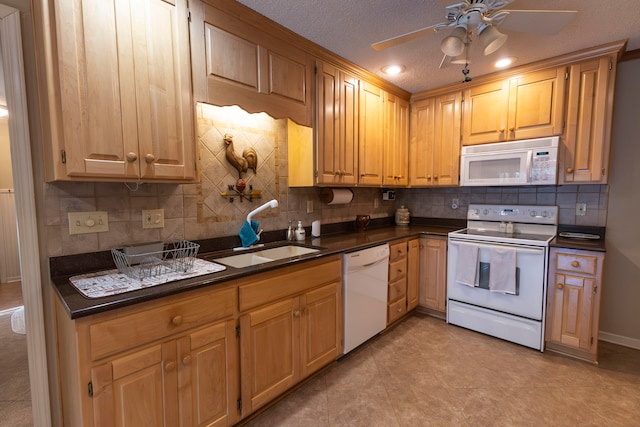 kitchen with ceiling fan, white appliances, sink, decorative backsplash, and a textured ceiling